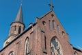 Catholic church in Hilden with weathercock and cross