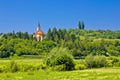 Catholic church on idyllic green hill