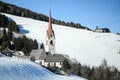 Catholic church in the Italian dolomites in wintertime with snow. Royalty Free Stock Photo