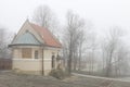 KALWARIA ZEBRZYDOWSKA, POLAND - NOVEMBER 25, 2019: Catholic church on a misty autumn day