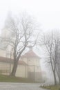 KALWARIA ZEBRZYDOWSKA, POLAND - NOVEMBER 25, 2019: Catholic church on a misty autumn day