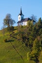 Catholic church of St. Jacob on top of the hill in Slovenia at early sunset Royalty Free Stock Photo