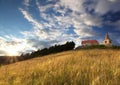 Catholic church with sun and storm Royalty Free Stock Photo