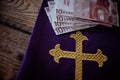 Catholic church symbols and Euro banknotes Royalty Free Stock Photo