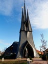 Catholic church tower with natural shining slate roofing