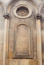 Catholic church wall with columns and round window