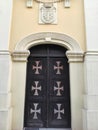 Catholic Church wooden door with crosses in Ruma Serbia Royalty Free Stock Photo
