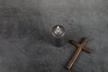 Catholic Cross with burning candle. Ash Wednesday, Lent season, Holy Week, Good Friday and Palm Sunday concept. Royalty Free Stock Photo