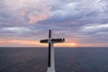 Catholic cross in a flooded cemetery in the sea near the island of Camiguin. Royalty Free Stock Photo