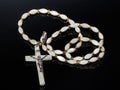 Catholic cross made of silver and mother-of-pearl. Antique jewelry Royalty Free Stock Photo