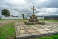 catholic crucifix in stone on the right side, chapel sra das Neves on the left side. Castelo Branco District