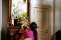 Catholic devotees pray to religious images and statues inside the Antipolo Cathedral