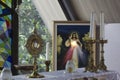 Catholic Eucharistic adoration chapel with Divine Mercy picture of Jesus Christ, candles and holy bread of life. Royalty Free Stock Photo