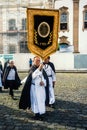 Catholic faithful walk the streets of Pelourinho with banners du