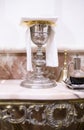 Catholic liturgical chalice, wine pitcher and bell Royalty Free Stock Photo