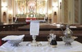 Catholic liturgical object. Chalice, communion wafers, wine, water, ewer and basin Royalty Free Stock Photo