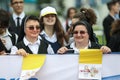 Catholic nuns sing, hold rosaries and Vatican flags while waiting for Pope Francis to come in his first visit in Romania Royalty Free Stock Photo