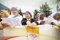 Catholic nuns sing, hold rosaries and Vatican flags while waiting for Pope Francis to come in his first visit in Romania Royalty Free Stock Photo