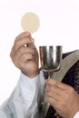 Catholic priest with chalice and host at Communion Royalty Free Stock Photo
