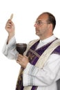 Catholic priest during communion in worship