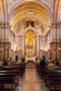 Catholic Priest conducting mass on Santo Antonio de Lisboa Church