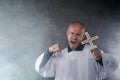 Catholic priest exorcist in white surplice and black shirt Royalty Free Stock Photo