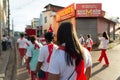 Catholic priest and faithful are seen during the procession of the Passion of Christ in the streets