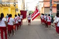 Catholic priest and faithful are seen during the procession of the Passion of Christ in the streets