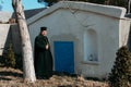 Catholic priest near the crypt