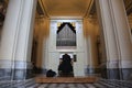 Catholic priest playing the pipe organ