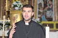 Catholic priest reading the Bible Royalty Free Stock Photo