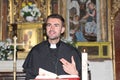 Catholic priest reading the Bible Royalty Free Stock Photo