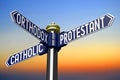 Catholic, Protestant, Orthodox - religion concept - signpost with three arrows, sunset sky