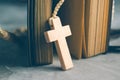 Catholic rosary beads with old book on cement table prayer, rosa