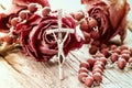 Catholic rosary and dry roses