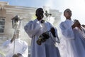 Catholic seminarians prepare with incense for the Palm Sunday procession