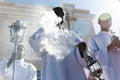 Catholic seminarians prepare with incense for the Palm Sunday procession