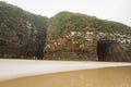 Cathedral Caves on Waipati Beach rise 30 metres above the flat sand in Catlins area Southland New Zealand Royalty Free Stock Photo