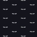 Cats eyes night seamless pattern. Black cats in a dark room Royalty Free Stock Photo