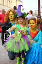 Cats and fairy, adults and children in fancy dress on the holiday