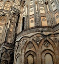 Master piece of art the Cathedral of  Monreale, facade detail arches, windows and coloured marbles Royalty Free Stock Photo