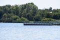 Cattenom, France - 08 22 2023: Reservoir lake, Lac du Mirgenbach, power plants side