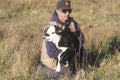 Cattle farmer holding calf in Bourbon, MO