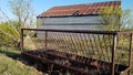 Cattle Feeder Behind North Texas Hay Barn