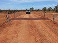 Cattle grid on gravel road in Australian Outback Royalty Free Stock Photo