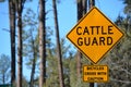 Cattle Guard warning sign and Bicycles Cross with Caution Sign. Gila County, Tonto National Forest, Arizona USA Royalty Free Stock Photo