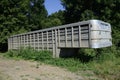Cattle mover parked in the weeds Royalty Free Stock Photo