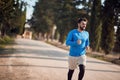 Caucasian adult man jogging in beautiful region of italy