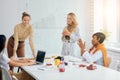 Team of female businesswomen working together in office Royalty Free Stock Photo