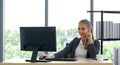 Caucasian apprentice in suit smiling happily as she embarks on a modern office trial Royalty Free Stock Photo